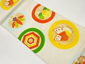 丸文に蝶・花・亀甲模様織出し袋帯